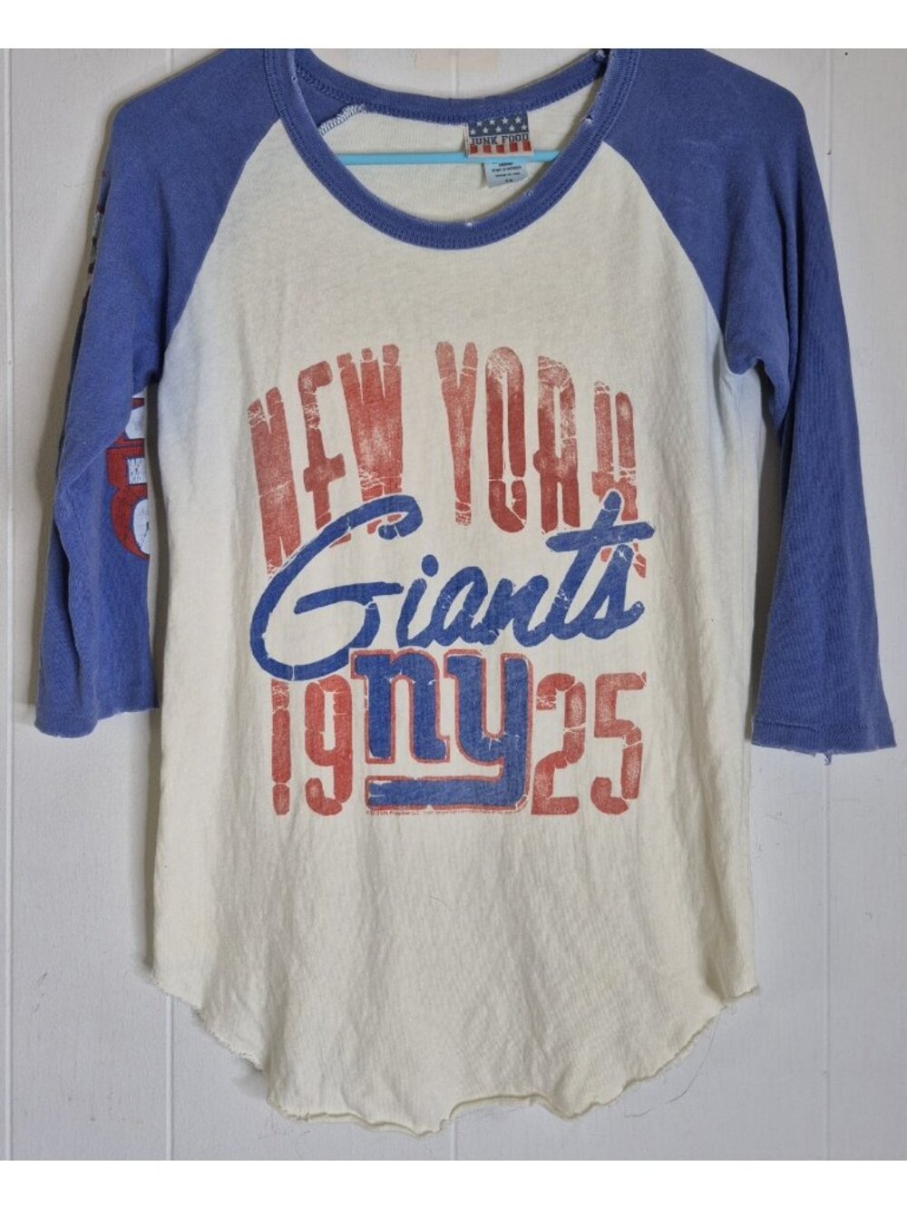 Junk Food brand raglan t-shirt features distressed vintage-style New York Giants